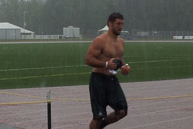 Photograph of supposed virginal Jet Tim Tebow, shirtless and in the rain, by KristianRDyer on Twitter